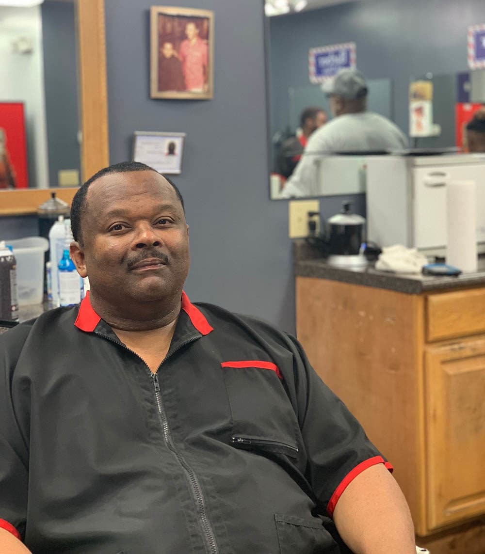 Christopher Toliver in his barber shop. (Tonya Mosley/Here & Now)