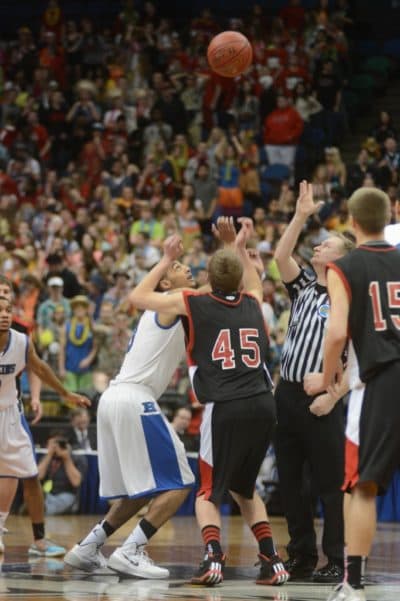 Toward the end of the game, jump balls provided much of the action. (Courtesy Hopkins High School)