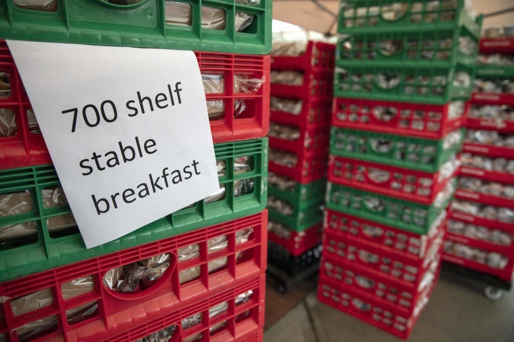 Boston Public Schools positioned 700 school breakfasts and lunches at the YMCA in East Boston for kids to take home if they were not able to attend school. (Robin Lubbock/WBUR)