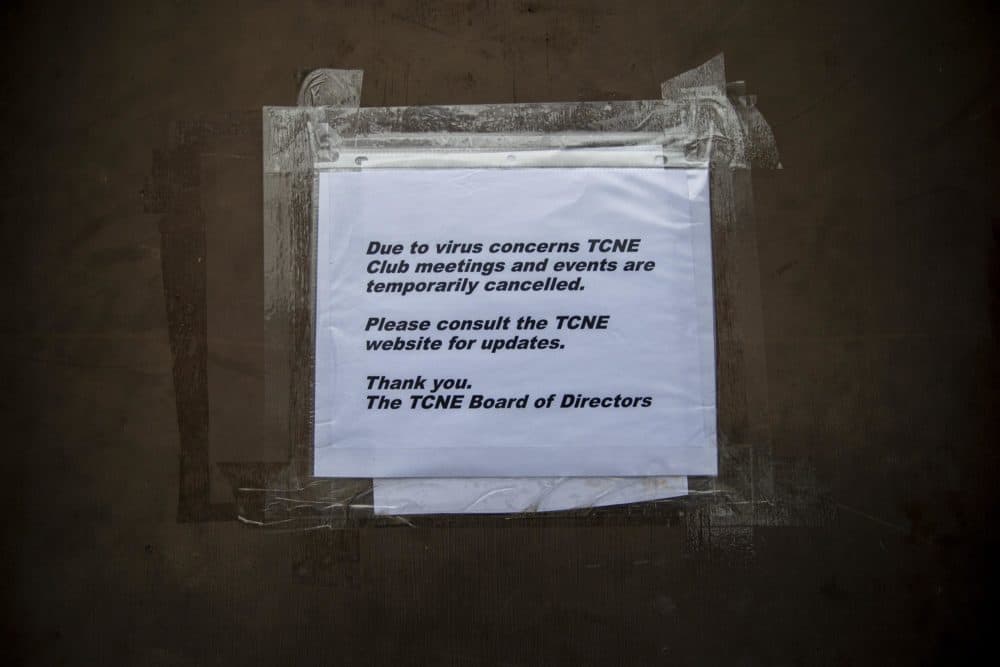 A sign is taped to the door of the Trans Club of New England telling members the club is closed due to concerns with the coronavirus. (Jesse Costa/WBUR)