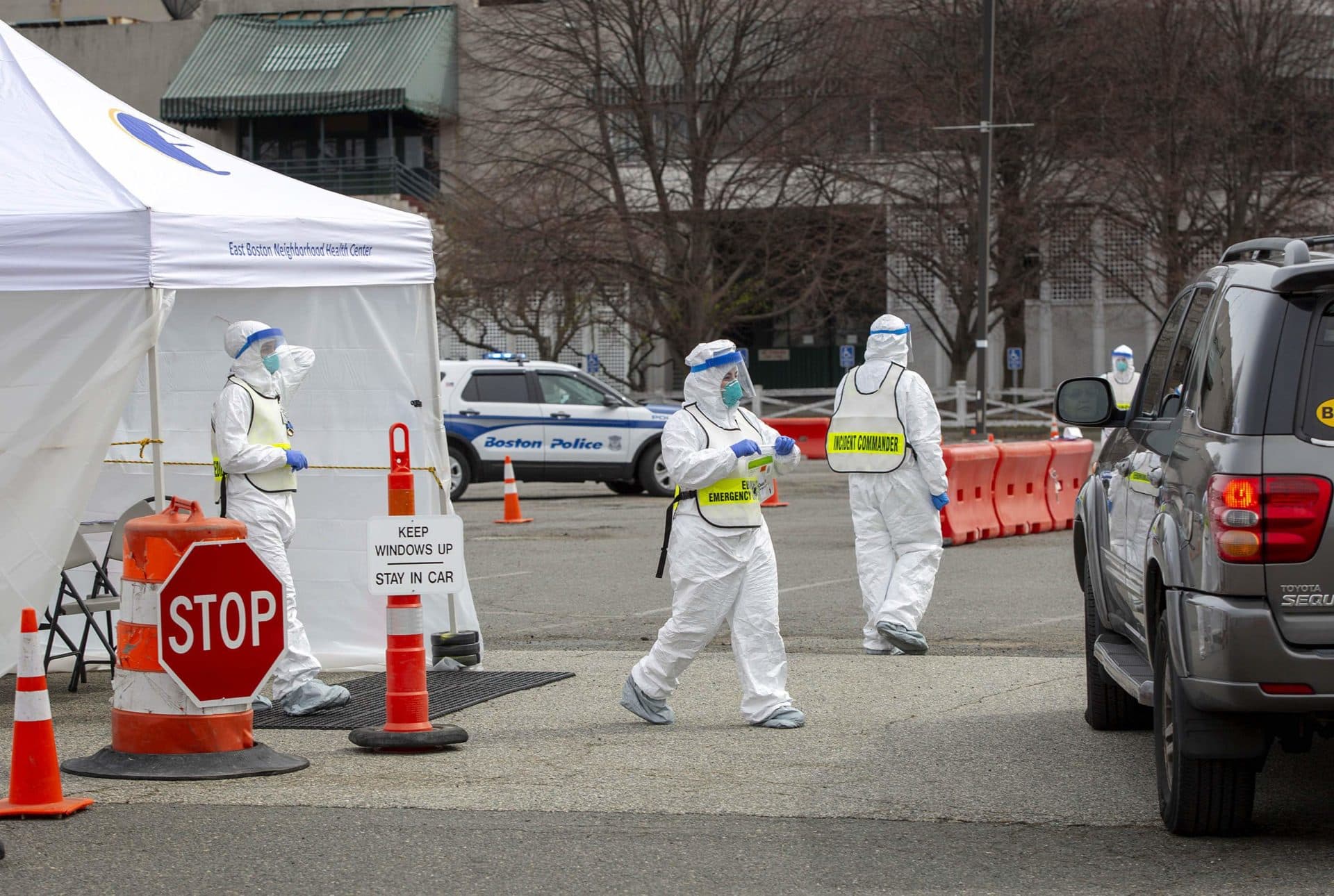 Medical staff check in a person at the drive through COVID-19 testing station at Suffolk Downs. (Robin Lubbock/WBUR)