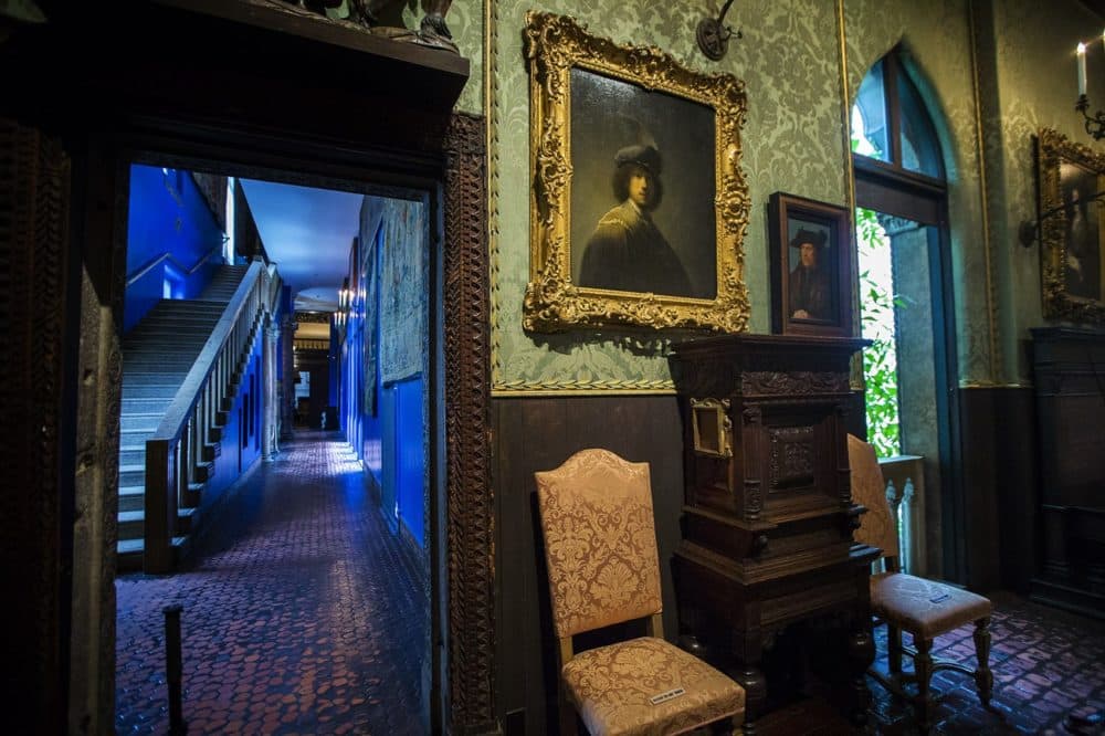 "Self Portrait" by Rembrandt on the wall of the Dutch Room, as well as the empty frame of his "Self Portrait" etching, mounted to the side of the cabinet below. (Jesse Costa/WBUR)