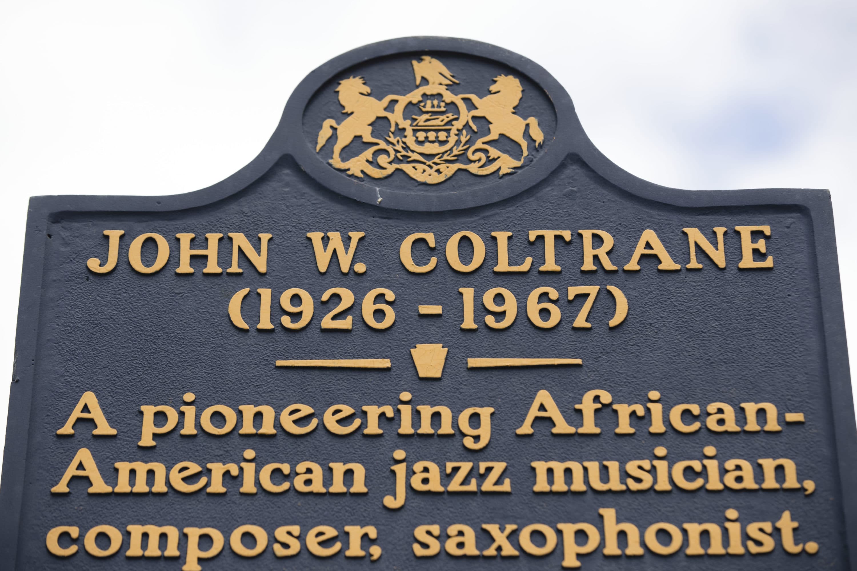 A historic marker posted outside the former home of jazz musician John Coltrane in Philadelphia. (Matt Rourke/AP)