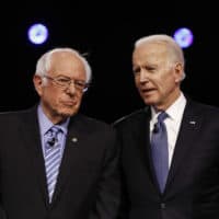 Democratic presidential candidates, Sen. Bernie Sanders, I-Vt., former Vice President Joe Biden, talk before a Democratic presidential primary debate, Tuesday, Feb. 25, 2020, in Charleston, S.C. (Matt Rourke/AP)