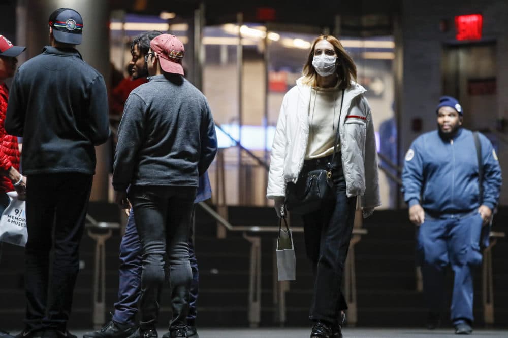 A commuter wears a face mask in the New York City transit system, Monday, March 9, 2020, in New York. (John Minchillo/AP)