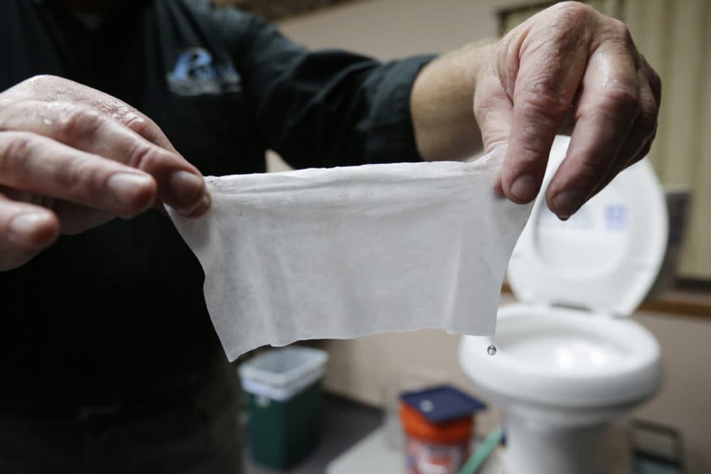 More people are clogging wastewater treatment systems with erroneously labeled "flushable" wipes. (Julio Cortez/AP)