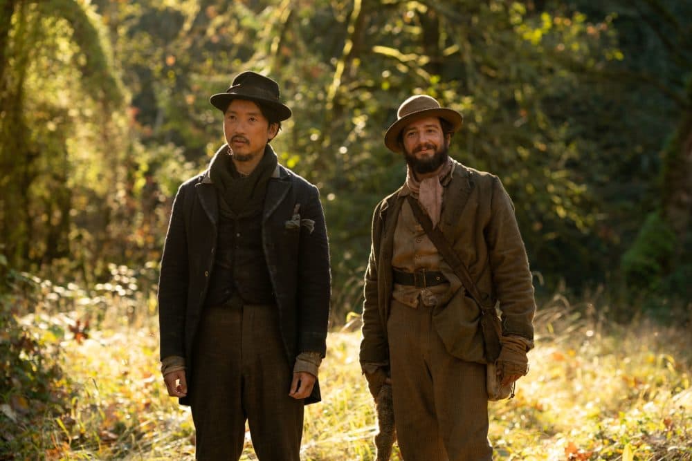 Orion Lee (left) as King Lu and John Magaro as Otis "Cookie" Figowitz in "First Cow." (Courtesy A24)