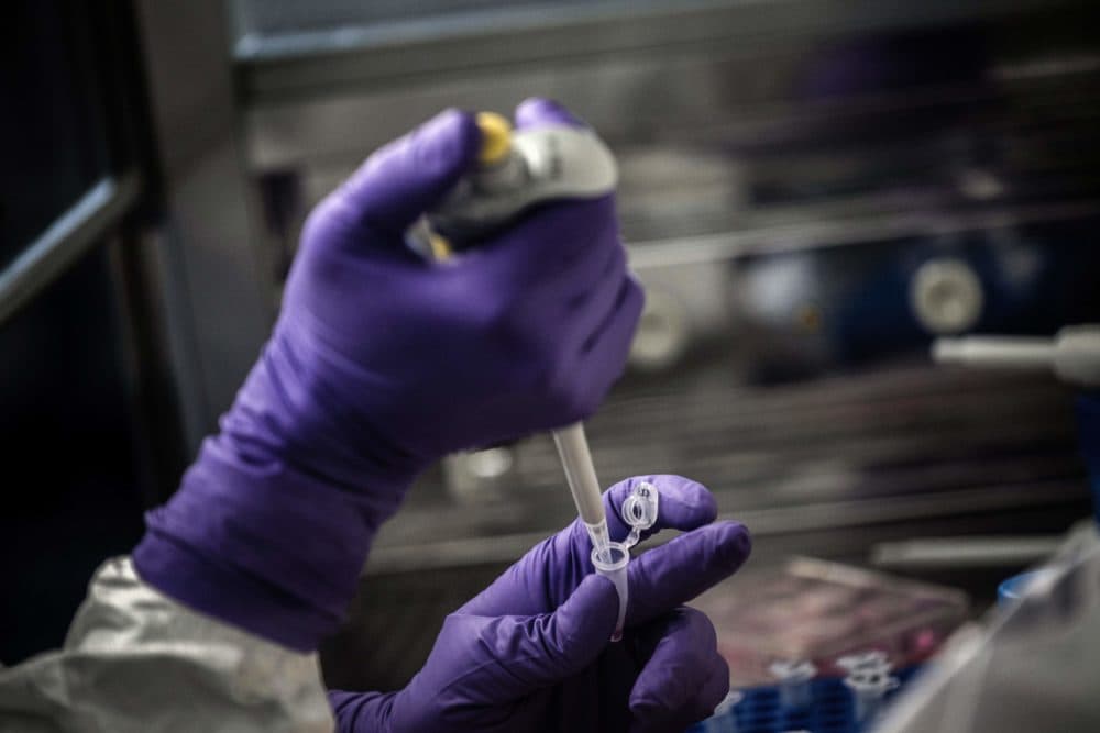 A scientist is at work in the VirPath university laboratory, classified as "P3" level of safety, on February 5, 2020 as they try to find an effective treatment against the new coronavirus (Jeff Pachoud/AFP via Getty Images)