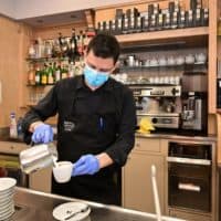 A waiter prepares a capuccino at a cafe in downtown Milan on March 10, 2020. (MIGUEL MEDINA/AFP via Getty Images)
