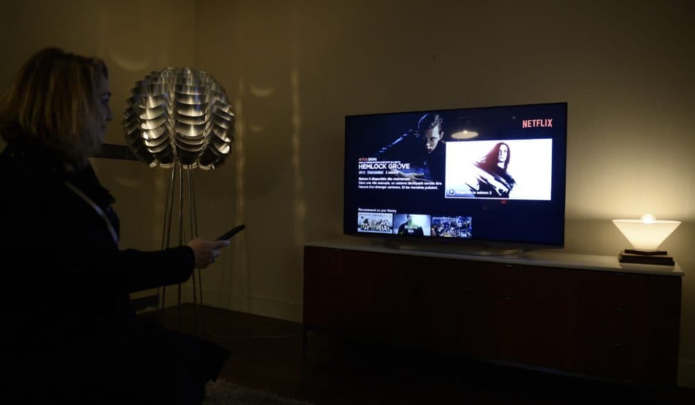 This photo shows a television screen displaying the French user interface of U.S. online streaming giant Netflix, on September 15, 2014 in Paris. (STEPHANE DE SAKUTIN/AFP via Getty Images)