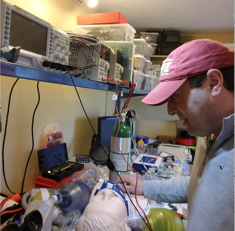 Worcester Polytechnic Institute Professor Greg Fischer works in his basement on a simple ventilator. (Courtesy)