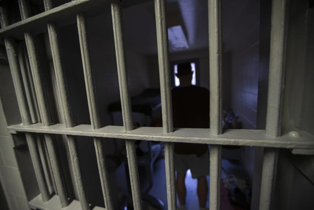 An inmate stands in a cell inside one of Massachusetts' county jails. (Jesse Costa/WBUR)