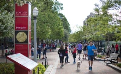 Boston University students walk past the school's student union. (Robin Lubbock/WBUR)