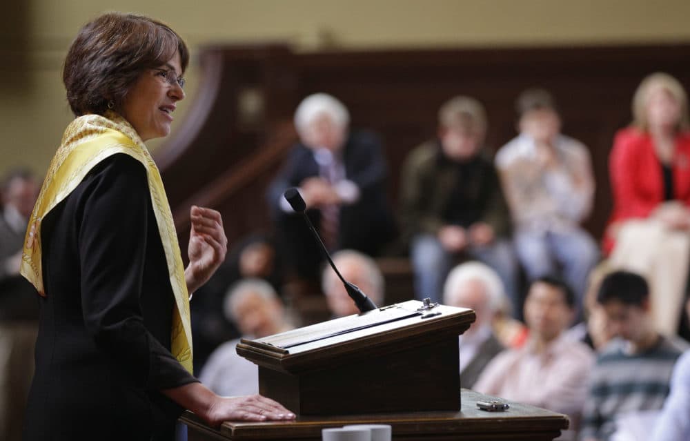 Princeton University economist and Dean of the Woodrow Wilson School of Public and International Affairs Christina Hull Paxson laughs as she tells a story about her brother during her introduction as the 19th President of Brown University in Providence, RI., Friday, March 2, 2012. (Stephan Savoia/AP)