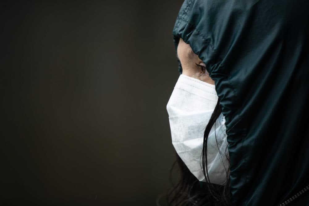 Kris Jaeger with Broad Street Ministry waits to distribute food outside of City Hall in Philadelphia, Monday, April 13, 2020. (Matt Rourke/AP)