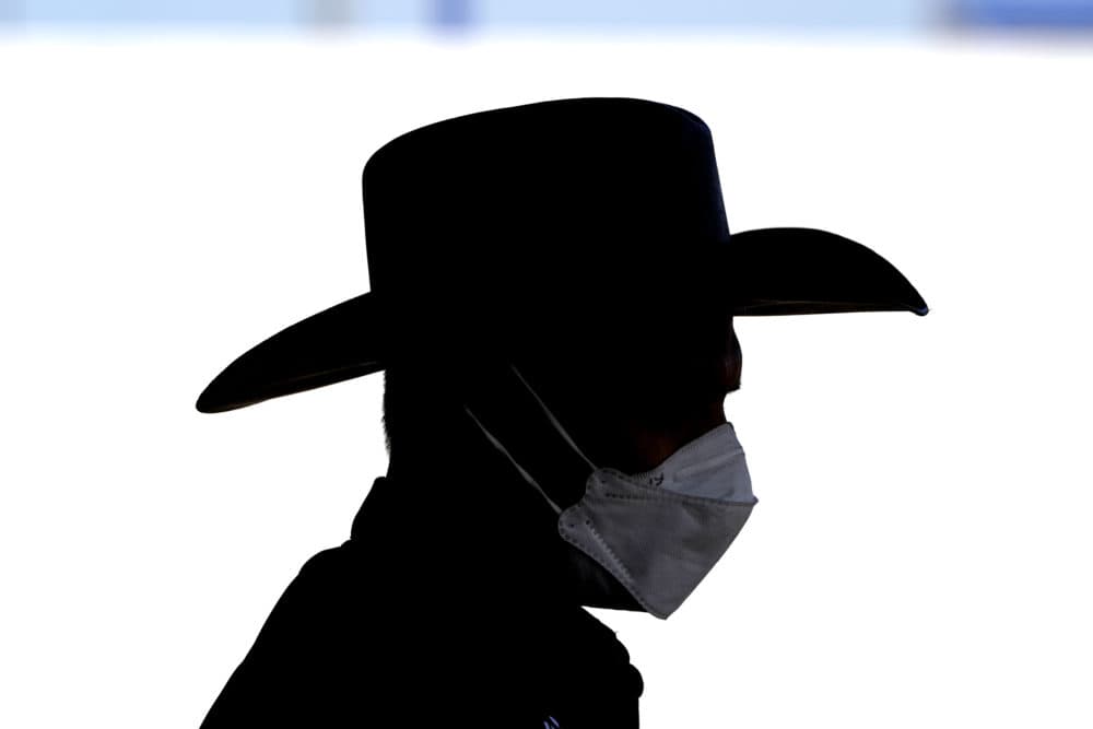 Site director Raheel Khan wears a face mask while helping setup at a newly opened United Memorial Medical Center COVID-19 drive-thru testing site Monday, April 27, 2020, in Houston. (David J. Phillip/AP)