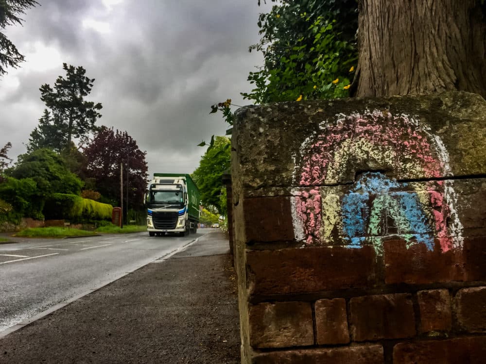 A chalk rainbow is seen on a wall as a symbol of hope during the coronavirus lockdown in Leominster, Herefordshire on April 30, 2020. (Jim Wood/Barcroft Media via Getty Images)