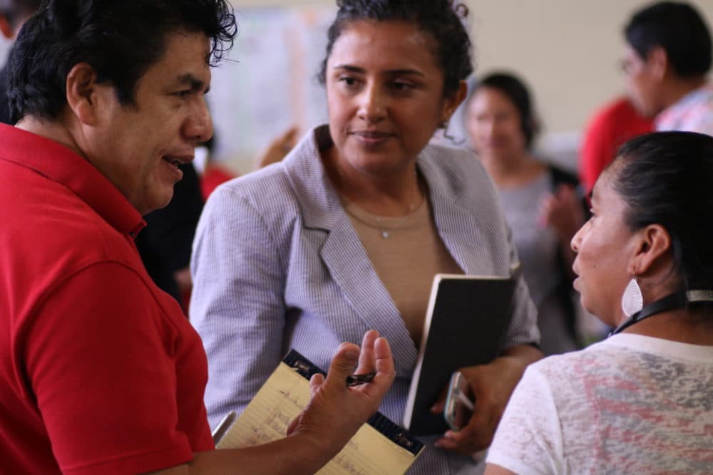 Magaly Uridales, center, who co-directs the Western North Carolina Workers' Center, at a convening of the poultry workers' coalition in Morgantown, N.C. (Mary Babic/Oxfam)