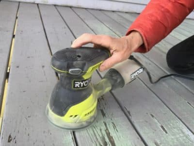 Jane sanding her back porch. (Courtesy)