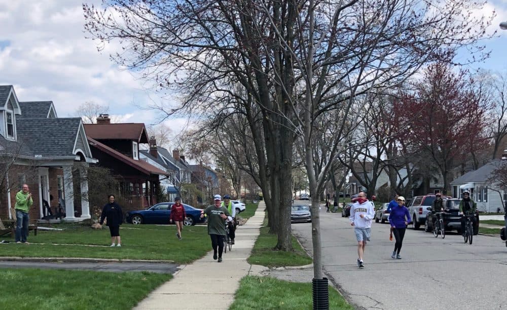 John didn't have the half a million spectators or the tens of thousands of runners alongside him like at the Boston Marathon. But he had his community. (Christie Bacon)
