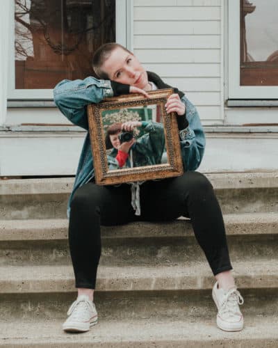 Photographer Ally Schmaling takes a self-portrait in their friend Margaret’s mirror. (Courtesy Ally Schmaling)
