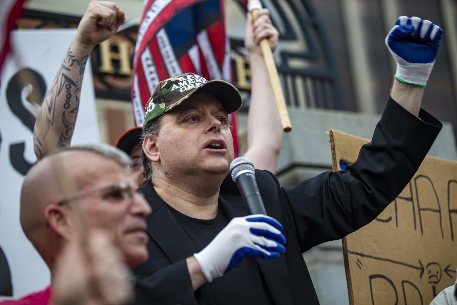 Talk radio host and political commentator Jeff Kuhner addresses the crowd in front of the Massachusetts State House. (Jesse Costa/WBUR)