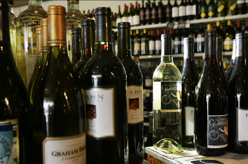 Wine bottles are seen at McAloon's Liquors in North Andover. (Elise Amendola/AP)
