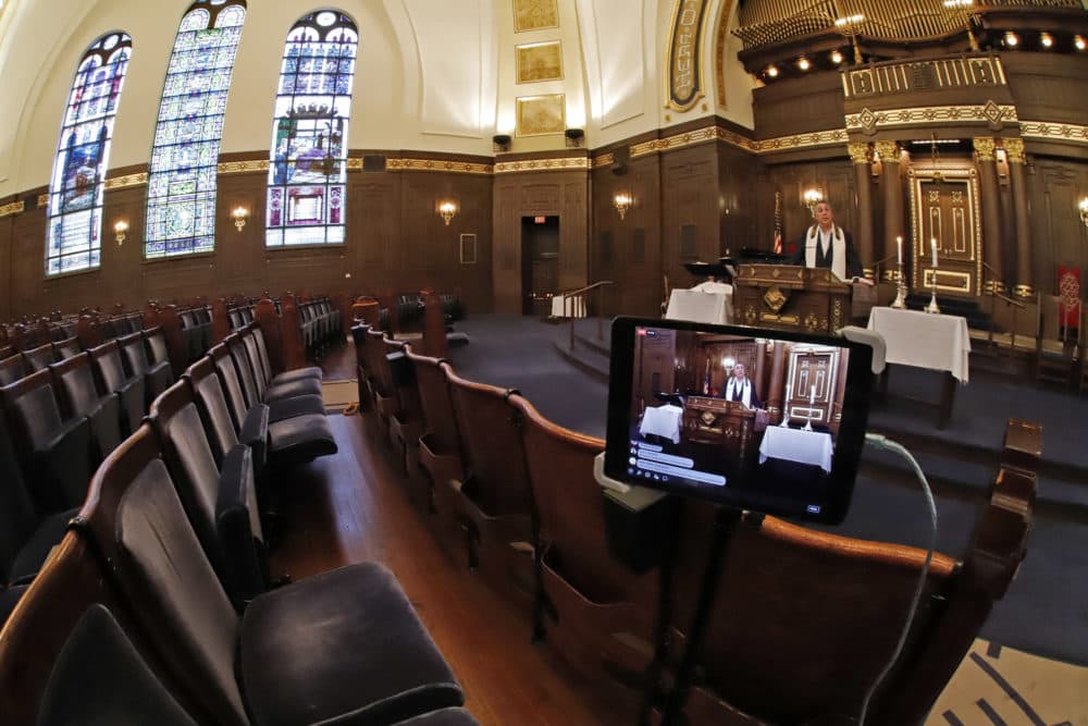 Rabbi Aaron Bisno, right, delivers his sermon during an Erev Shabbat service that is being streamed live on Facebook, Friday, March 20, 2020. (Gene J. Puskar/AP)