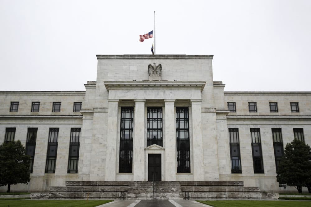Before the coronavirus pandemic shut down the U.S. economy, corporate debt was soaring to new highs. Now companies are falling into bankruptcy because they don't have the cash to pay back their loans. (Patrick Semansky/AP)