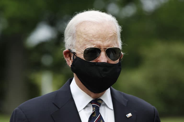 Democratic presidential candidate, former Vice President Joe Biden, with Jill Biden, departs after laying a wreath at the Delaware Memorial Bridge Veterans Memorial Park, Monday, May 25, 2020, in New Castle, Del. (AP Photo/Patrick Semansky)