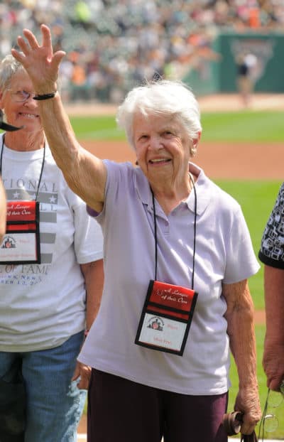 Mary Pratt waves to the crowd during a reunion ceremony before a 2010 game between the Detroit Tigers and the Chicago White Sox at Comerica Park in Detroit, Michigan. (Photo by Mark Cunningham/MLB Photos via Getty Images)