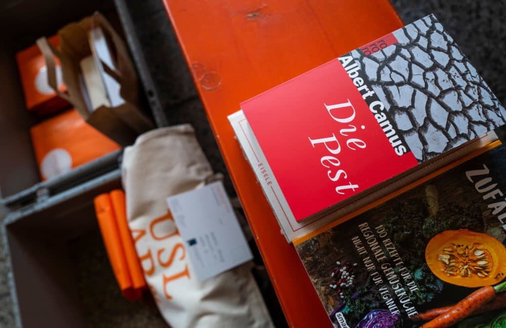French writer Albert Camus's book &quot;The Plague&quot; (Die Pest, La Peste) is put out for delivery at the Uslar & Rai Bookshop in Berlin's Prenzlauer Berg district on March 31, 2020, amid a new coronavirus COVID-19 pandemic. (JOHN MACDOUGALL/AFP via Getty Images)