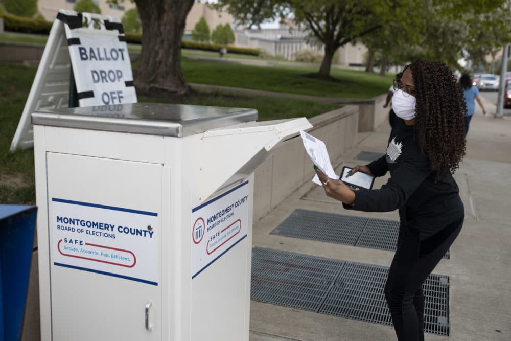 An Ohio voter drops off her ballot at the Board of Elections in Dayton, Ohio on April 28, 2020. (MEGAN JELINGER/AFP via Getty Images)
