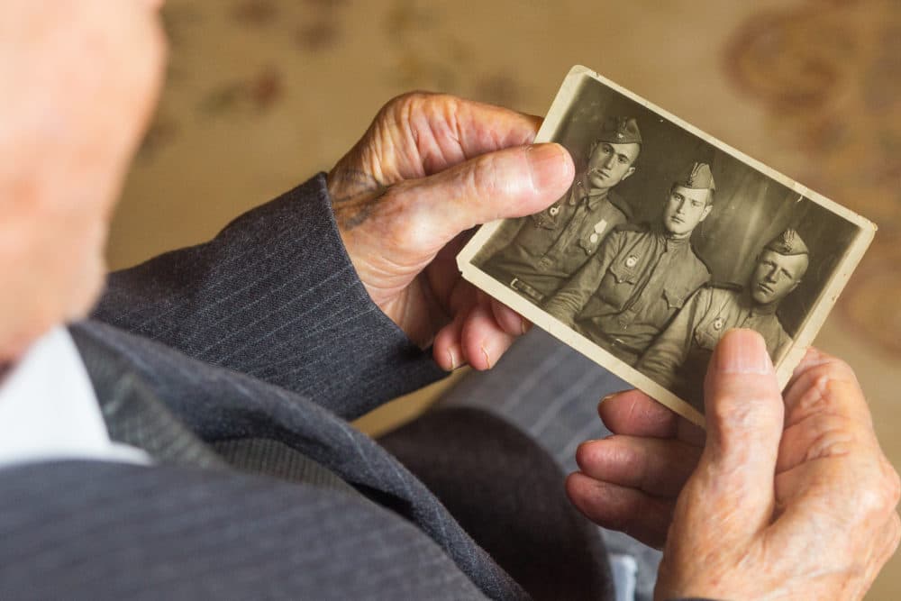 World War II veteran Alakbar Tahmazov, 98, shows his portrait in his house on May 7, 2020 in Baku, Azerbaijan. Azerbaijan will celebrate the 75th anniversary of the Allied victory over Nazi Germany in World War II on May 9. (Aziz Karimov/Getty Images)
