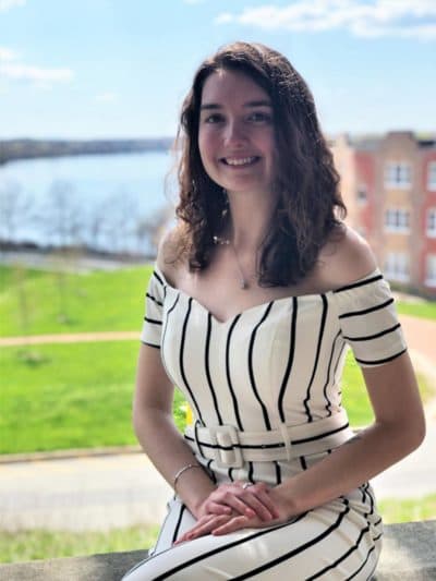 Meagen Timmins sits for graduation portraits on the UMass Lowell campus. Lowell has a degree from the university in history and is looking for a job or internship. (Courtesy: Meagen Timmins)