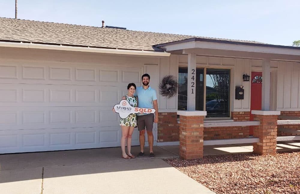 Robert Gifford and his wife outside their Tempe, Ariz., home. A few weeks after their offer was accepted, Gifford lost his job. (Courtesy)