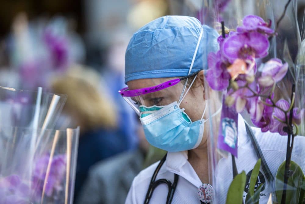 Health care workers at Beth Israel Deaconess Medical Center receive orchids as a tribute to their work on the frontline of the Coronavirus pandemic. (Jesse Costa/WBUR)