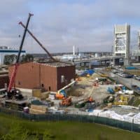 Work under way on the construction of the gas compressor station in Weymouth. (Robin Lubbock/WBUR)