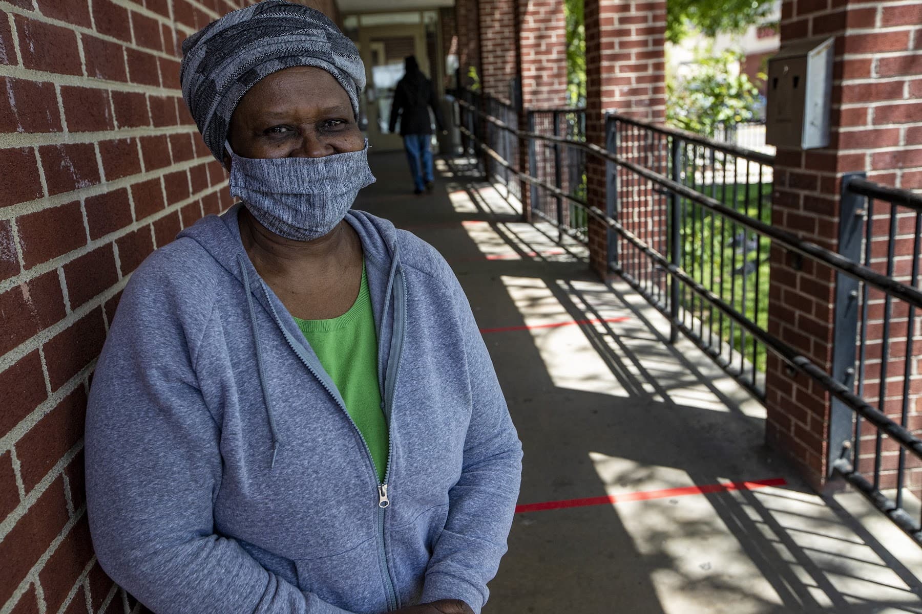 Lucy and other women who are housed and coming to the Rosie's Place food pantry tent can't go inside the facility for meals and services during the pandemic. (Jesse Costa/WBUR)