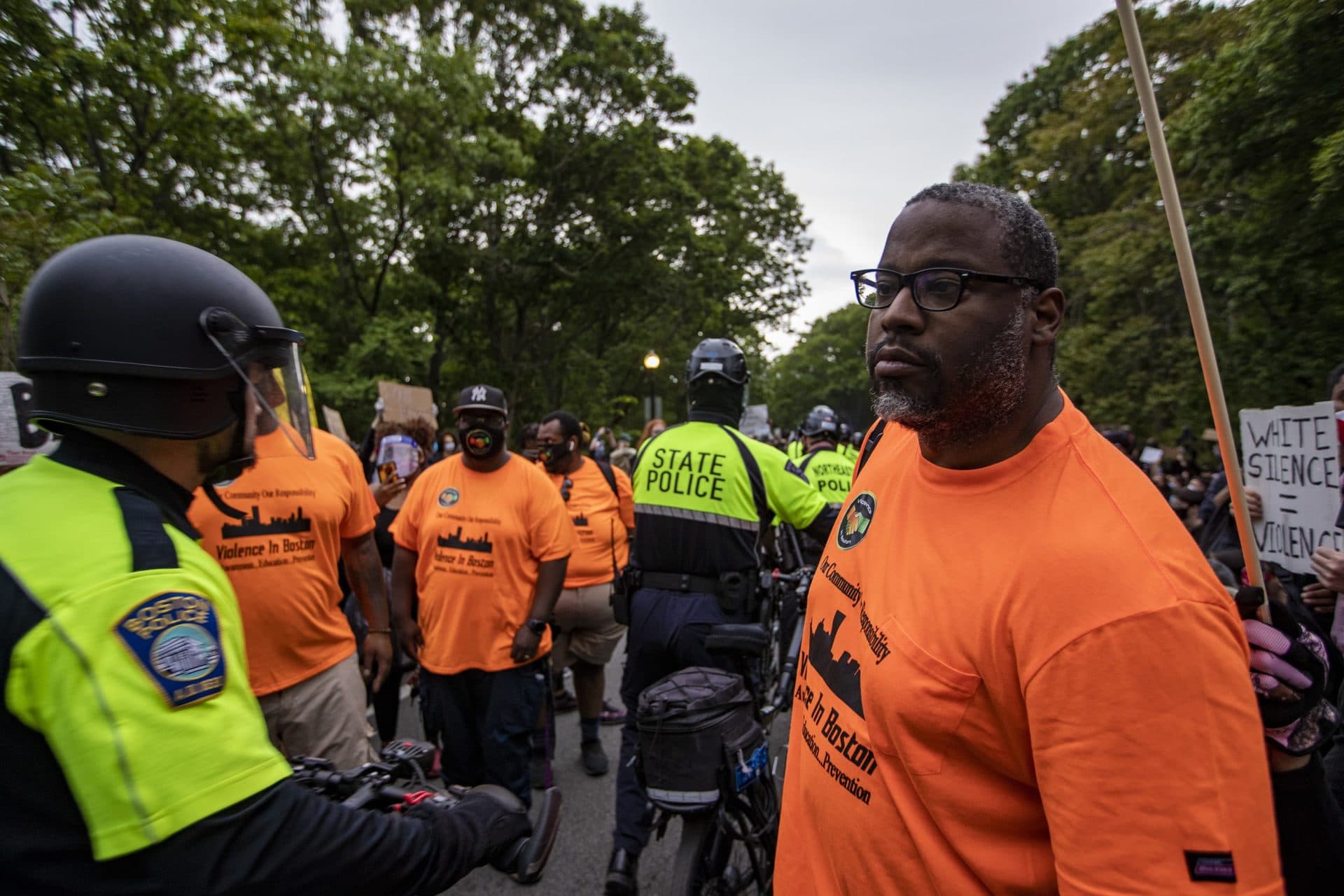 Former City Councillor Tito Jackson walks in to seek resolution between police and protesters. (Jesse Costa/WBUR)