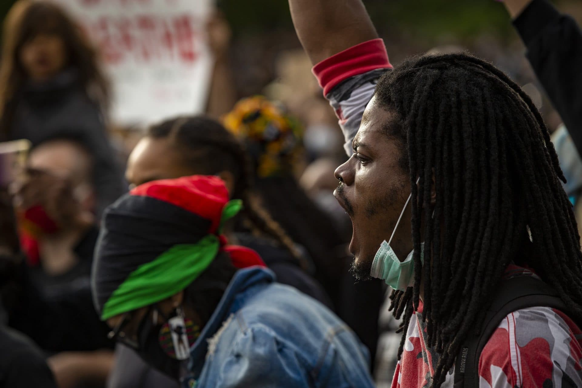 A protester reacts during a speech by Monica Cannon-Grant. (Jesse Costa/WBUR)