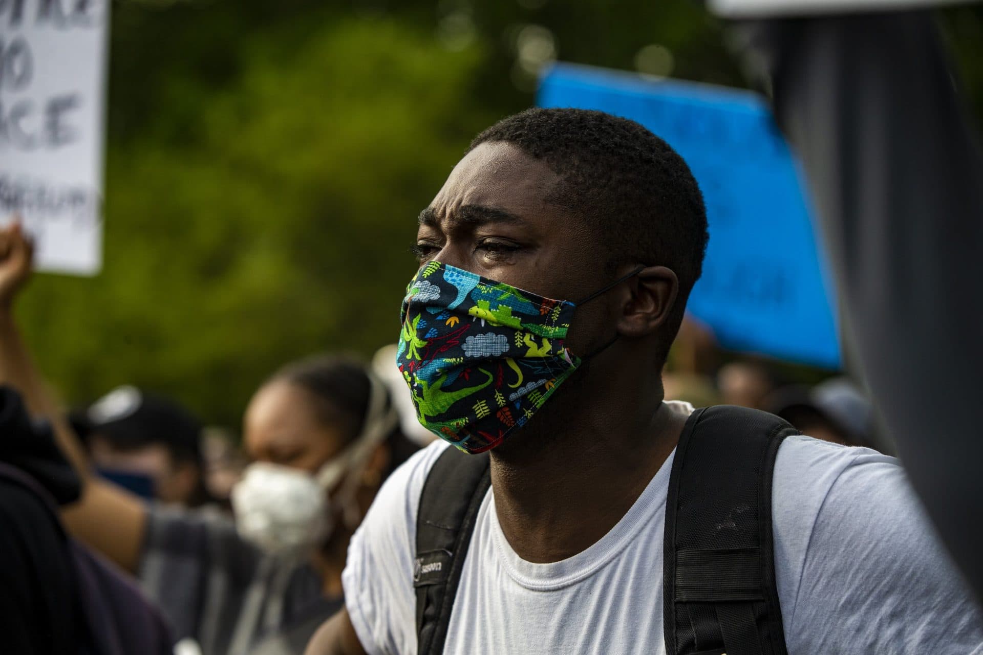 A protester is in tears listening to a speech made during the Black Lives Matter vigil in Roxbury. (Jesse Costa/WBUR)