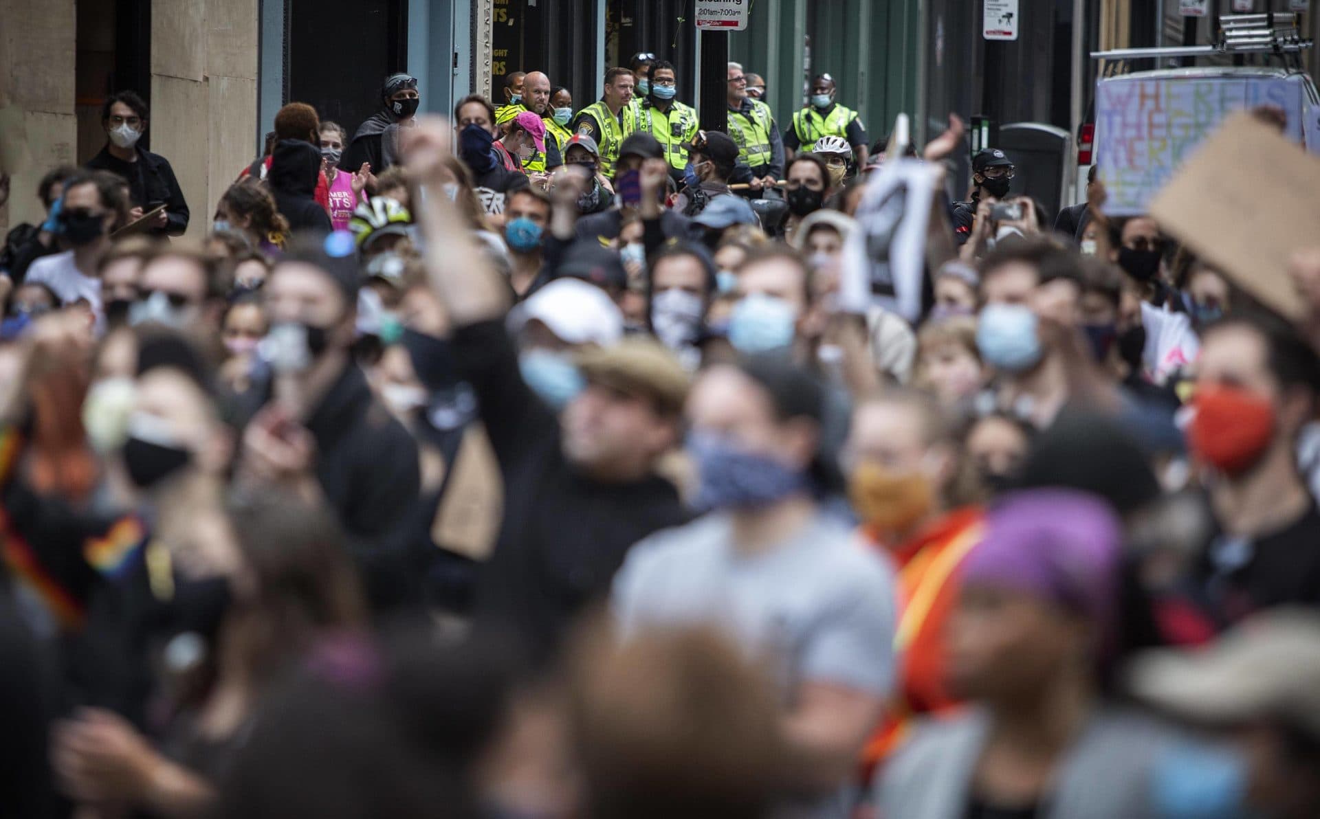 Police watching the For The People march from Bromfield Street. (Robin Lubbock/WBUR)