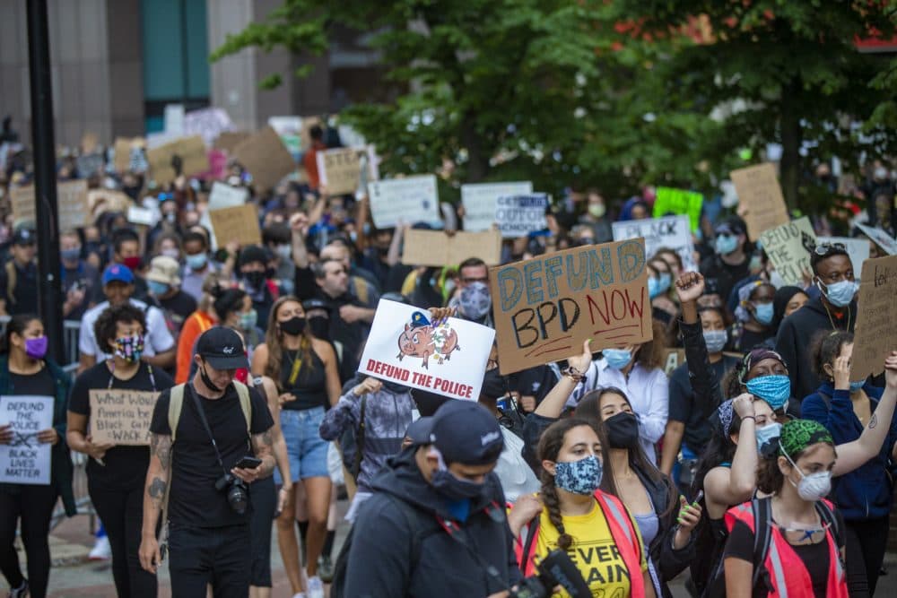 Hundrreds of protesters march into Boston City Hall Plaza during the F.T.P. March to Defund Police and Fund Our Communities. (Jesse Costa/WBUR)
