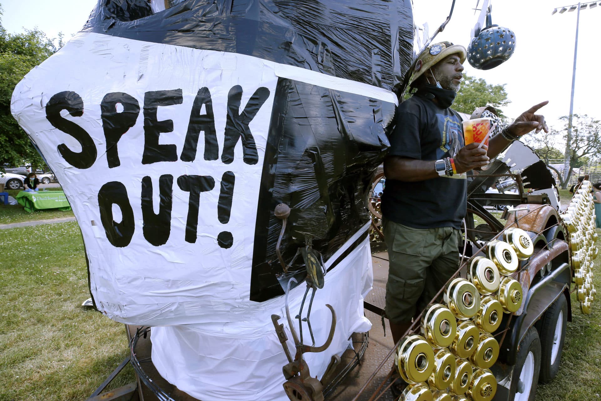 Darren Wells speaks from his float during a Juneteenth celebration at Town Field in Dorchester. (Michael Dwyer/AP)