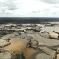 Peruvian jungle devastated by wild cat gold miners is seen from the air in Madre de Dios, Peru, March 5, 2019. Peruvian officials inaugurated the first of four military bases Tuesday where soldiers will use drones and satellite images to protect the Amazon. The unprecedented move comes two weeks after authorities evicted thousands of illegal gold miners blamed with contaminating Amazon lands and rivers with mercury. (Guadalupe Pardo/Pool Photo via AP)