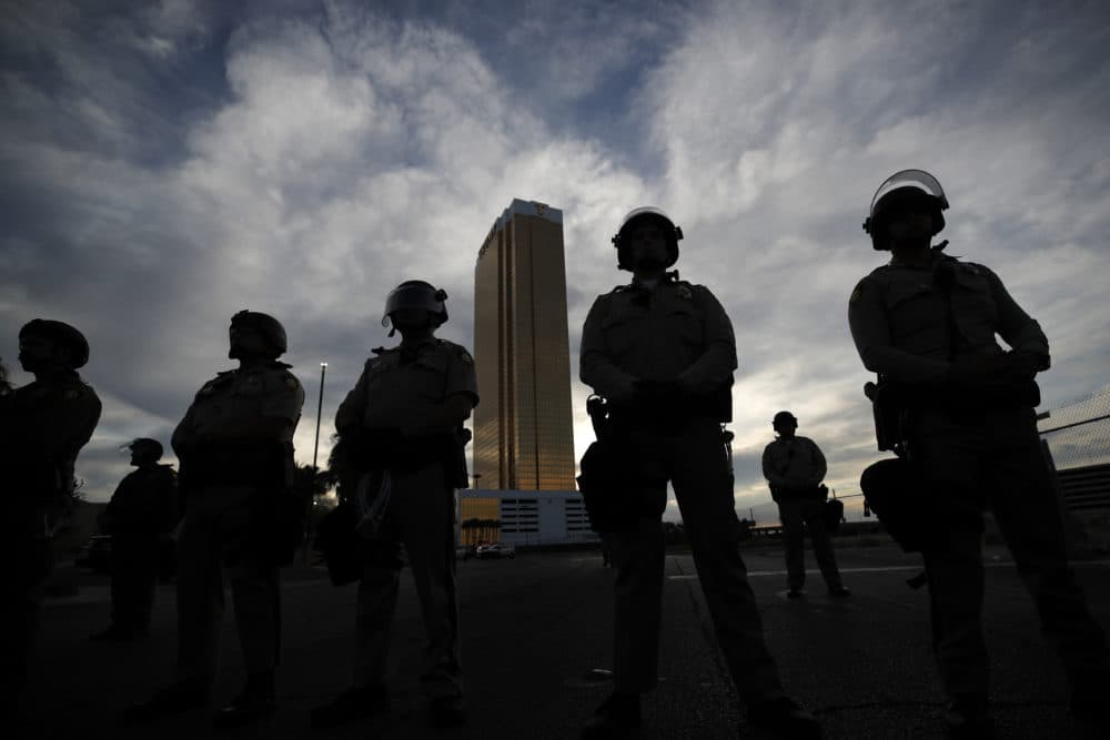 Police stand guard as protesters rally at the Trump Tower, Monday, June 1, 2020, in Las Vegas, over the death of George Floyd. (John Locher/AP)