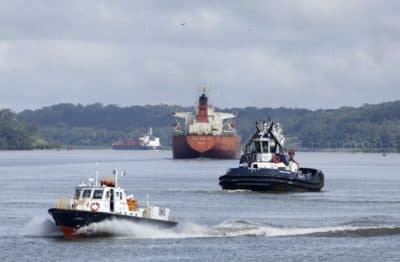 Cargo ships navigate Panama Canal waters in Gamboa, Panama, Wednesday, June 17, 2020. The Panama Canal began to feel the first adverse effects of the coronavirus pandemic on its business after registering a drop in its ship transits while applying rigorous measures to prevent further contagion among its workers. (Arnulfo Franco/AP)