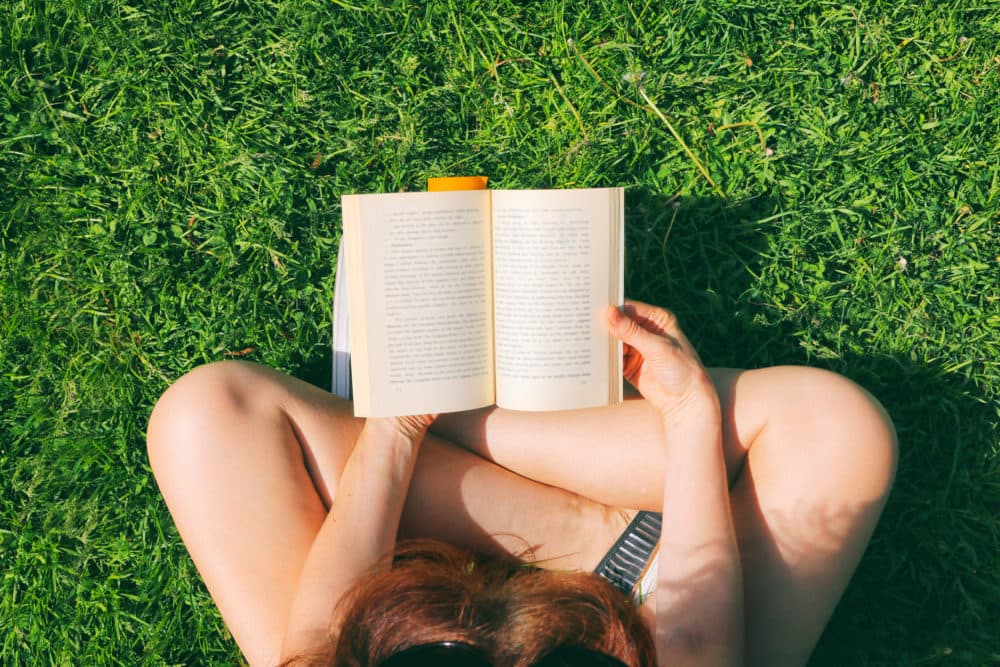 Reading in the park. (Getty Images)