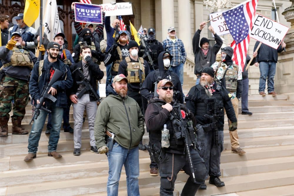 People take part in a protest for "Michiganders Against Excessive Quarantine" at the Michigan State Capitol in Lansing, Michigan on April 15, 2020. (Jeff Kowalsky/AFP via Getty)
